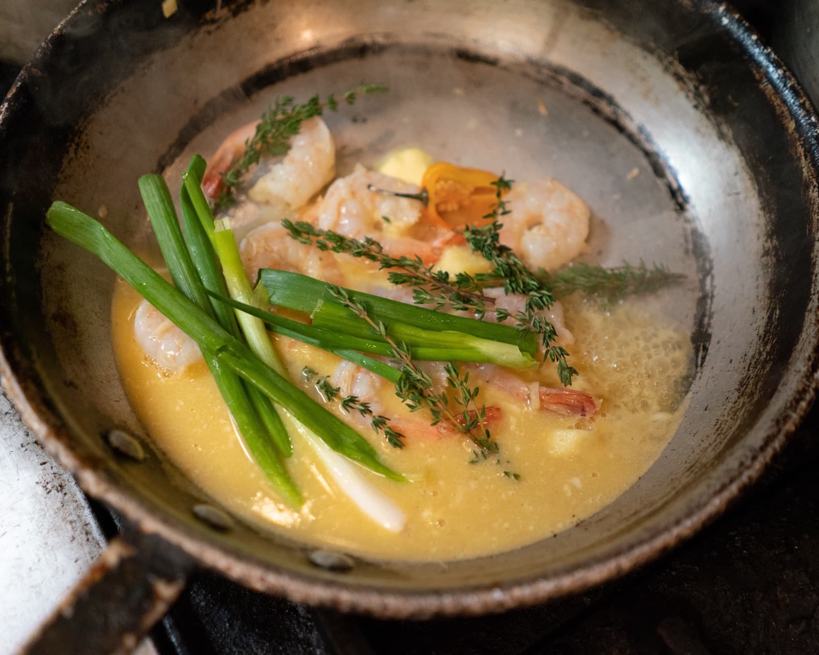 Herb-finished dish in progress